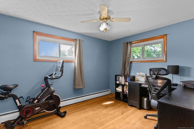 24 Claudia Ave, Brooklyn, CT 06234 - office area featuring a baseboard radiator, light wood-style floors, baseboard heating, and a ceiling fan