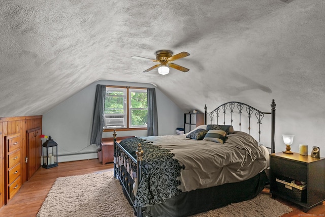 24 Claudia Ave, Brooklyn, CT 06234 - bedroom with wood finished floors, a baseboard heating unit, cooling unit, vaulted ceiling, and ceiling fan