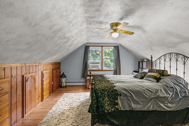 24 Claudia Ave, Brooklyn, CT 06234 - bedroom with baseboard heating, light wood-style floors, lofted ceiling, a textured ceiling, and ceiling fan