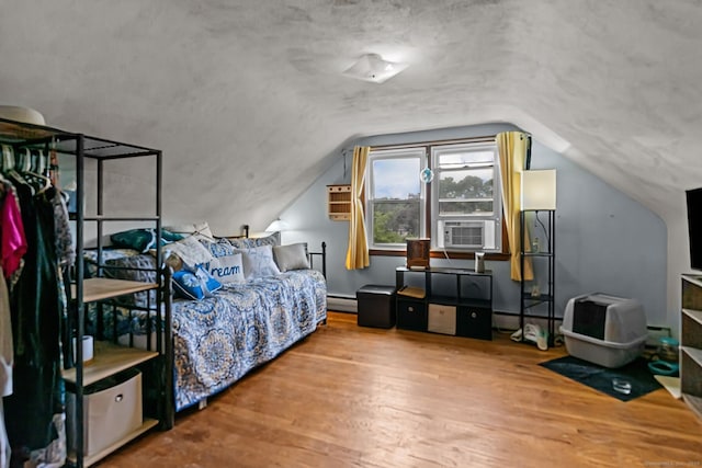 24 Claudia Ave, Brooklyn, CT 06234 - bedroom with cooling unit, baseboard heating, wood finished floors, and lofted ceiling