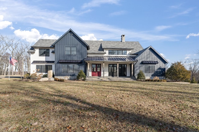 22 Serene Way, Newtown, CT 06470 - view of front of house featuring a standing seam roof, board and batten siding, a front lawn, a chimney, and a porch