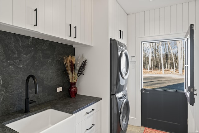 22 Serene Way, Newtown, CT 06470 - laundry area featuring stacked washer / drying machine and cabinet space