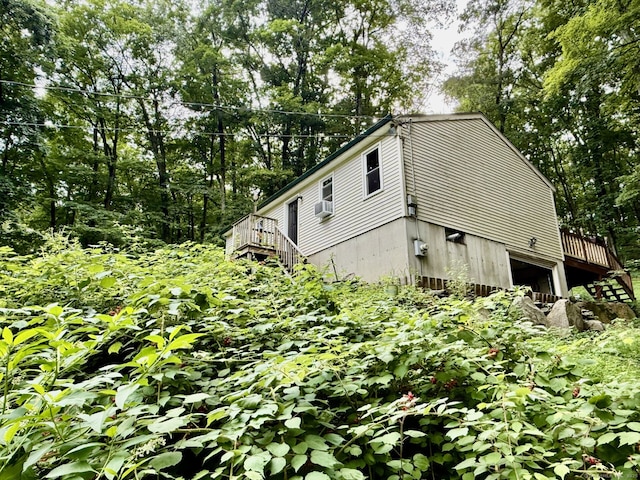 21 Pigeon Swamp Rd, Lebanon, CT 06249 - view of side of home with stairway, cooling unit, and a deck