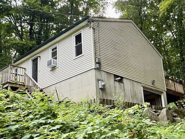 21 Pigeon Swamp Rd, Lebanon, CT 06249 - view of home's exterior with a wooden deck, cooling unit, and stairs