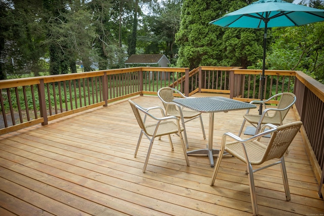 65 Willard St, Hamden, CT 06518 - deck featuring view of wooded area, an outdoor structure, and outdoor dining space