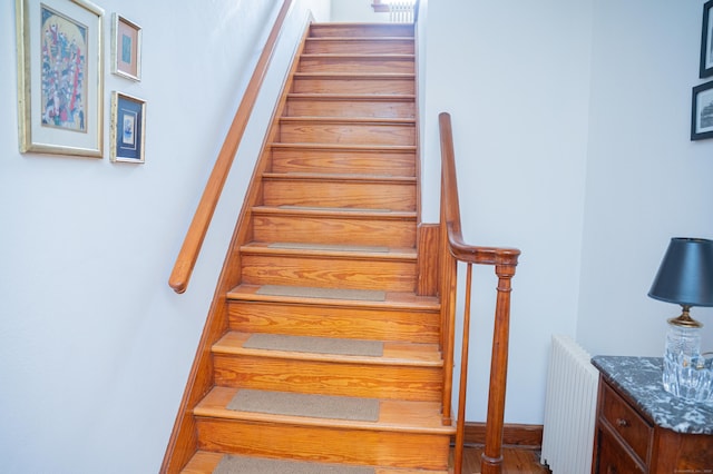 65 Willard St, Hamden, CT 06518 - staircase featuring radiator heating unit and wood finished floors