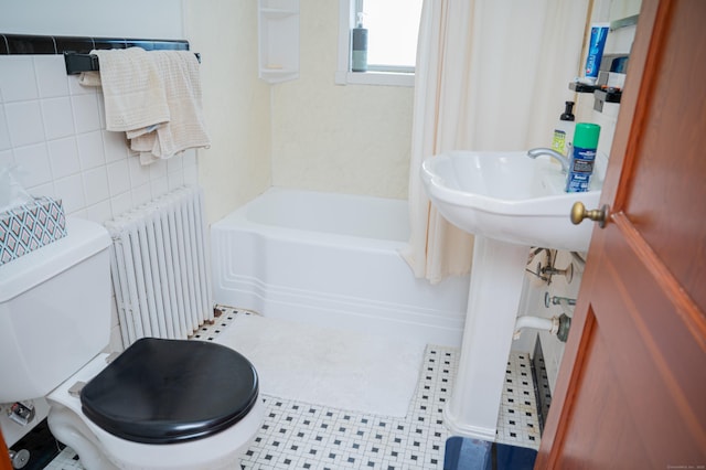 65 Willard St, Hamden, CT 06518 - bathroom with radiator, tile walls, and bathing tub / shower combination