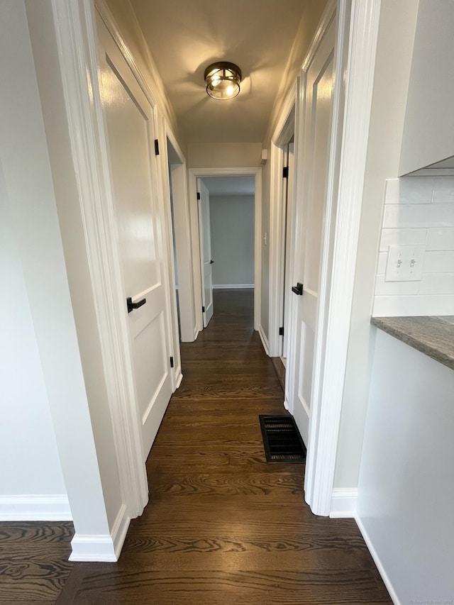 63 Barraclough Ave, Hamden, CT 06517 - corridor with dark wood-style floors and baseboards