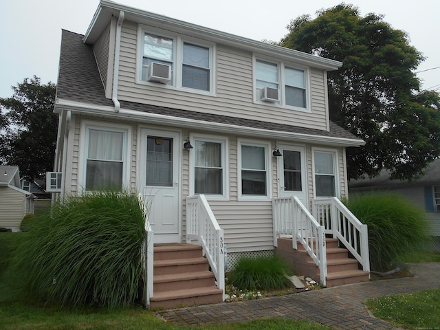 30 Hartford Ave Unit B, Old Lyme, CT 06371 - view of front facade featuring a shingled roof, entry steps, and cooling unit