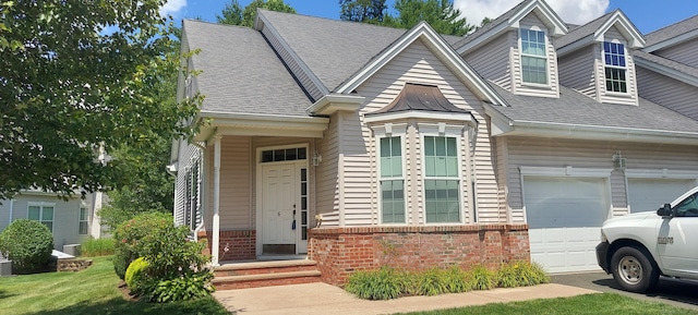 6 Haskins Rd Unit 6, Windsor, CT 06095 - view of front of house featuring brick siding, an attached garage, and roof with shingles