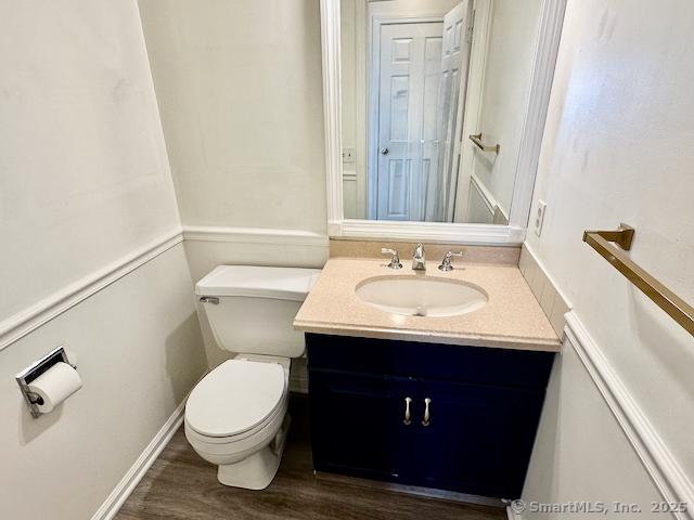 2390 State St Apt 7J, Hamden, CT 06517 - half bath featuring vanity and wood finished floors
