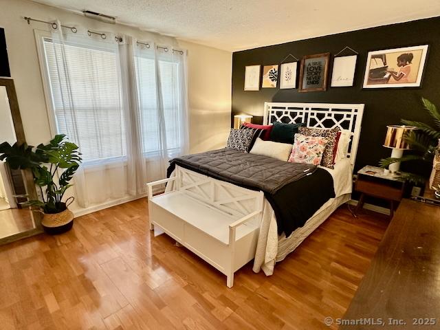 2390 State St Apt 7J, Hamden, CT 06517 - bedroom with wood finished floors