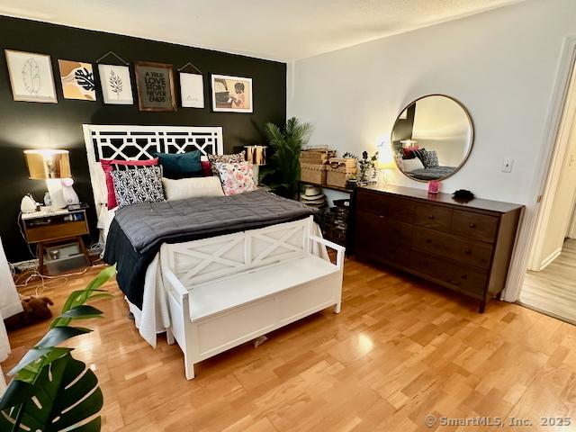 2390 State St Apt 7J, Hamden, CT 06517 - bedroom with light wood-type flooring