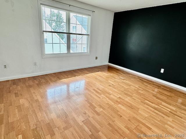 2390 State St Apt 7J, Hamden, CT 06517 - empty room with light wood-type flooring