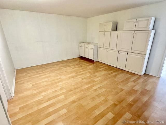 2390 State St Apt 7J, Hamden, CT 06517 - unfurnished bedroom with light wood-style floors