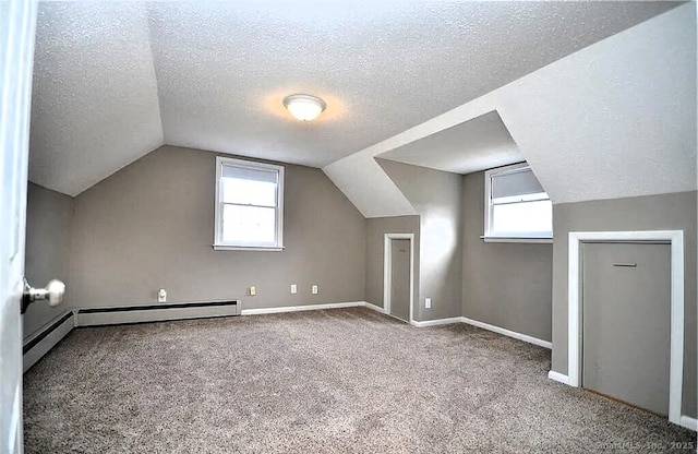 40 Mark St, Bristol, CT 06010 - bonus room featuring a textured ceiling, carpet, vaulted ceiling, and baseboard heating