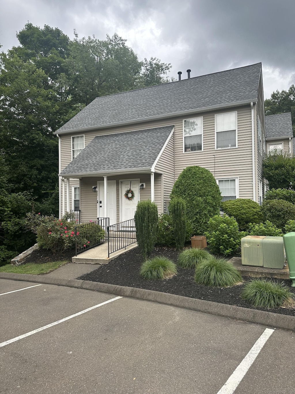 229 Branford Rd Unit 208, North Branford, CT 06471 - view of front facade featuring a shingled roof, uncovered parking, and covered porch