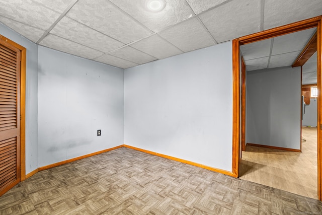 128 Auburn St, Stratford, CT 06614 - empty room featuring baseboards and a paneled ceiling
