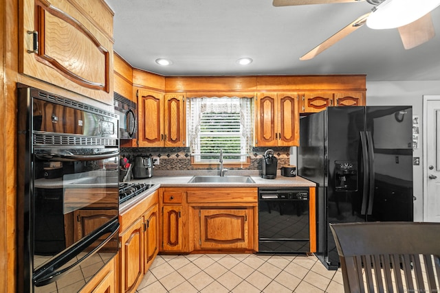 128 Auburn St, Stratford, CT 06614 - kitchen with black appliances, a warming drawer, light countertops, decorative backsplash, and brown cabinets