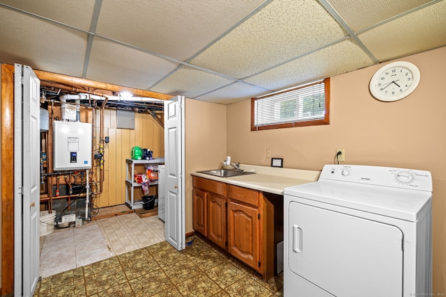 128 Auburn St, Stratford, CT 06614 - laundry area featuring washer / clothes dryer, cabinet space, water heater, and tile patterned floors