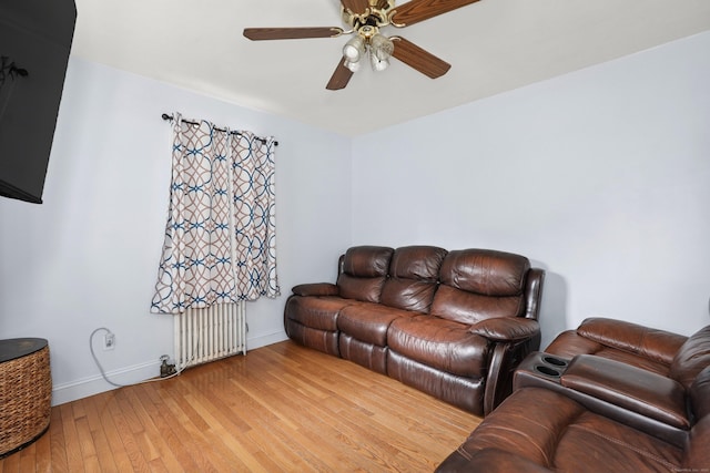 35 Oberlin Rd, Hamden, CT 06514 - living room with radiator, ceiling fan, and light wood-type flooring