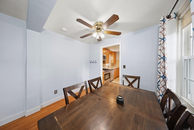 35 Oberlin Rd, Hamden, CT 06514 - dining space featuring a ceiling fan and light wood finished floors