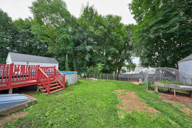 35 Oberlin Rd, Hamden, CT 06514 - view of yard featuring an outdoor pool, a wooden deck, and an outbuilding