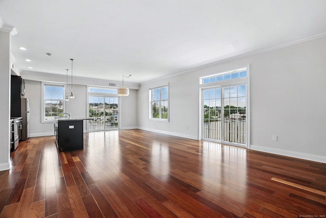 142 E Ave Unit A302, Norwalk, CT 06851 - unfurnished living room with dark wood-style floors, ornamental molding, and recessed lighting