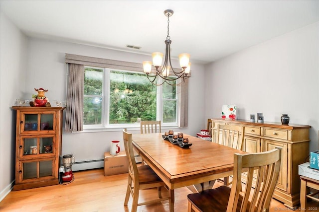 129 Russell Ave, Orange, CT 06477 - dining area with a chandelier, a baseboard heating unit, and light wood-style flooring