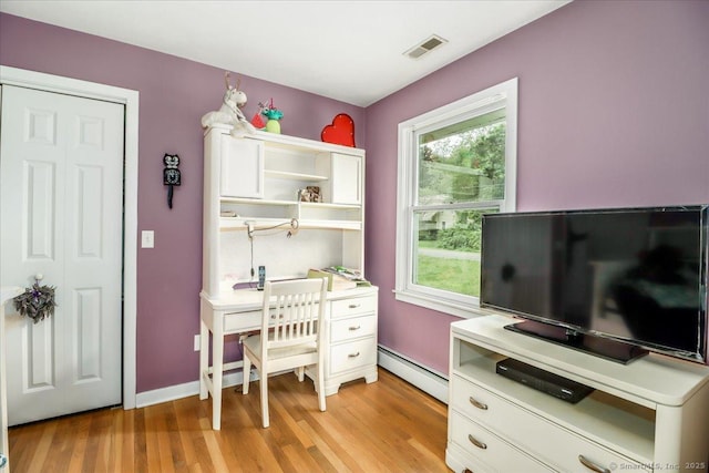 129 Russell Ave, Orange, CT 06477 - office area with baseboard heating and light wood-type flooring
