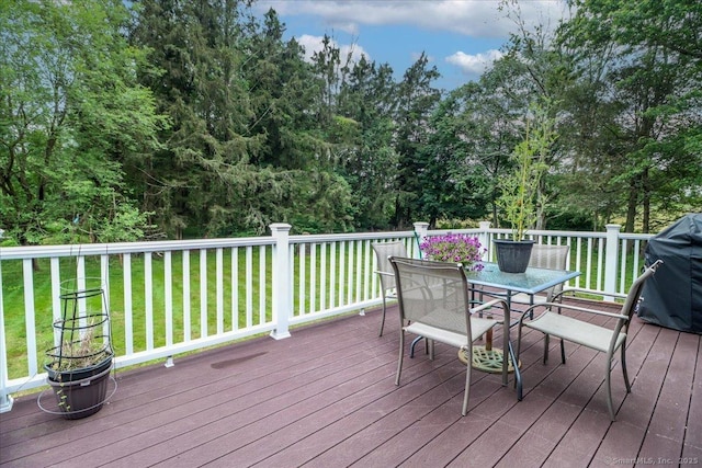 129 Russell Ave, Orange, CT 06477 - wooden terrace with outdoor dining space, a lawn, and a grill
