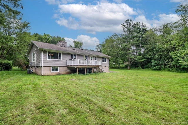 129 Russell Ave, Orange, CT 06477 - rear view of property with a wooden deck, a chimney, and a yard