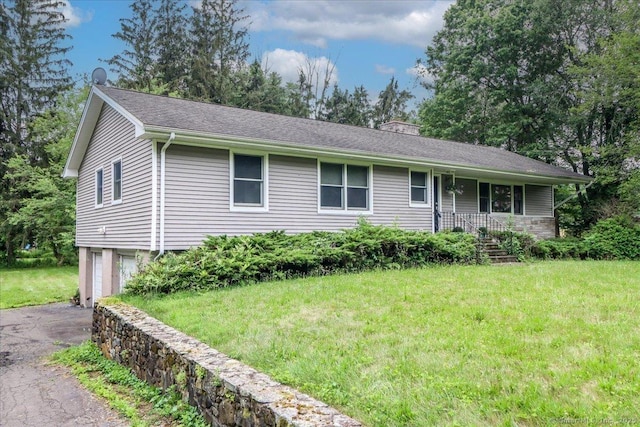129 Russell Ave, Orange, CT 06477 - ranch-style house featuring driveway, a front yard, a chimney, and a garage