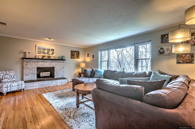 662 Booth Hill Rd, Trumbull, CT 06611 - living area featuring ornamental molding, wood finished floors, and a brick fireplace