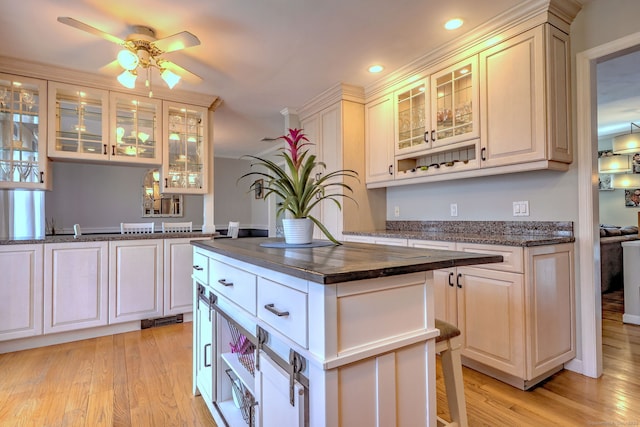 662 Booth Hill Rd, Trumbull, CT 06611 - kitchen with light wood finished floors, a ceiling fan, a center island, glass insert cabinets, and recessed lighting