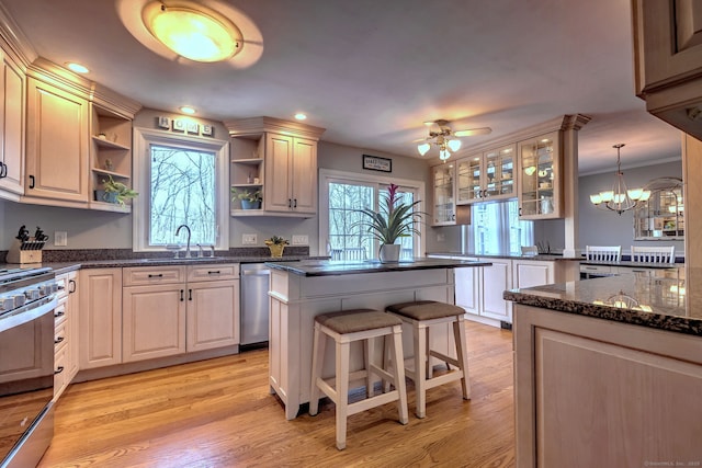 662 Booth Hill Rd, Trumbull, CT 06611 - kitchen featuring open shelves, appliances with stainless steel finishes, a breakfast bar, a kitchen island, and light wood-style floors
