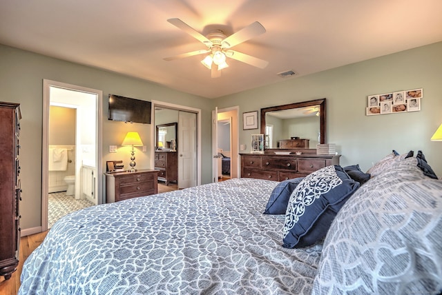662 Booth Hill Rd, Trumbull, CT 06611 - bedroom featuring wood finished floors, connected bathroom, ceiling fan, and a closet