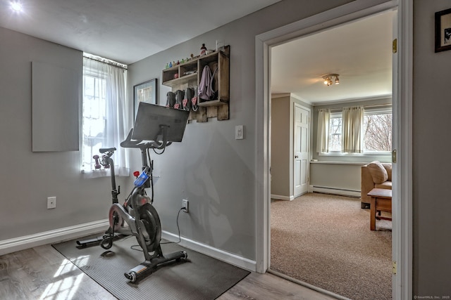 662 Booth Hill Rd, Trumbull, CT 06611 - workout room with baseboard heating, plenty of natural light, and wood finished floors