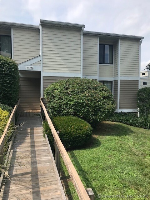 75 Lawson Ln Unit 75, Ridgefield, CT 06877 - rear view of house with a yard
