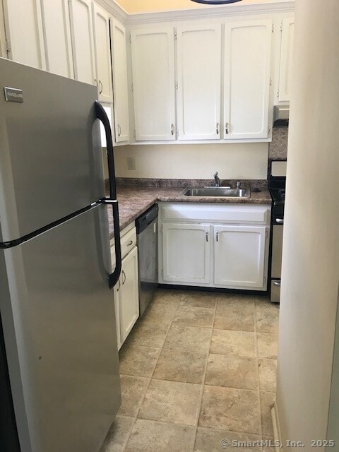 75 Lawson Ln Unit 75, Ridgefield, CT 06877 - kitchen featuring stainless steel appliances, stone finish flooring, and white cabinetry