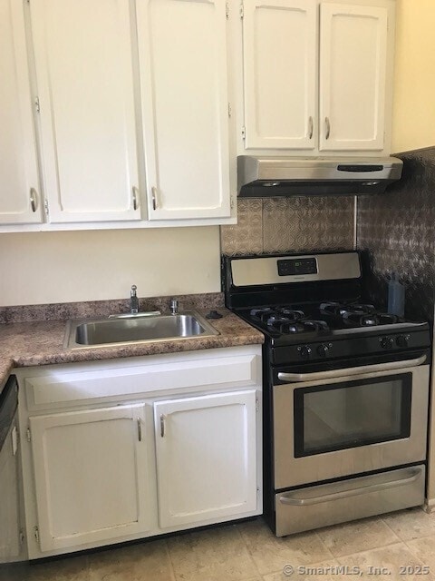 75 Lawson Ln Unit 75, Ridgefield, CT 06877 - kitchen with stainless steel range with gas cooktop, white cabinets, under cabinet range hood, and tasteful backsplash