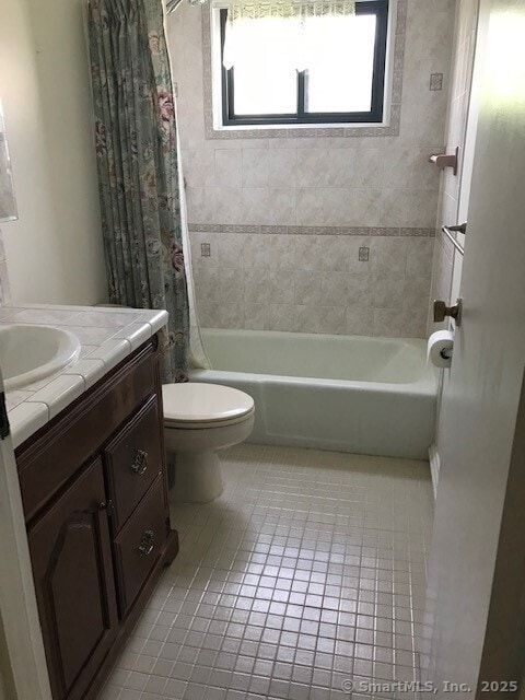 75 Lawson Ln Unit 75, Ridgefield, CT 06877 - bathroom featuring tile patterned flooring, vanity, and shower / bath combination with curtain