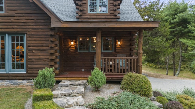 187 Chaplin Rd, Eastford, CT 06242 - property entrance with log siding and roof with shingles