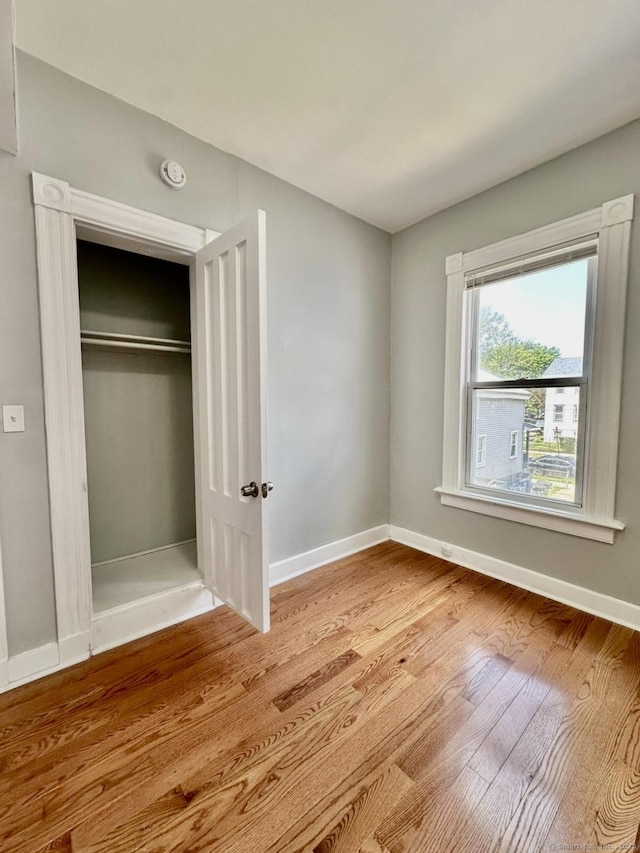 57 Houston St, New Haven, CT 06513 - unfurnished bedroom featuring wood finished floors and a closet