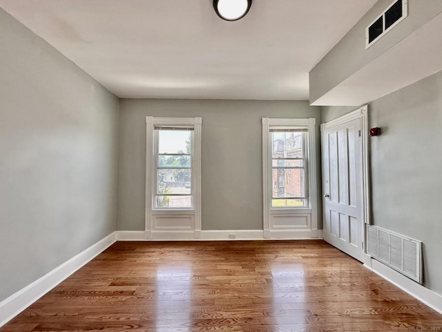 57 Houston St, New Haven, CT 06513 - spare room featuring wood finished floors and plenty of natural light