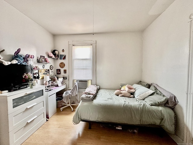 57 Houston St, New Haven, CT 06513 - bedroom with light wood-style flooring and cooling unit