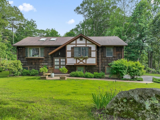 16 Pond Crest Rd, Danbury, CT 06811 - tudor-style house with a front yard and a shingled roof