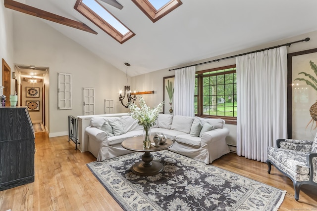 16 Pond Crest Rd, Danbury, CT 06811 - living room featuring a skylight, high vaulted ceiling, light wood-type flooring, beam ceiling, and a chandelier