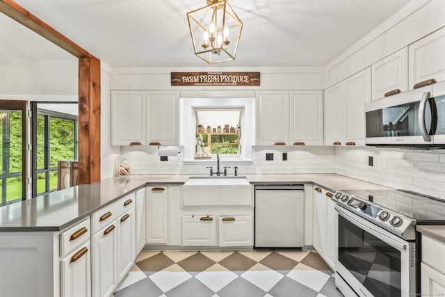 16 Pond Crest Rd, Danbury, CT 06811 - kitchen with appliances with stainless steel finishes, light floors, healthy amount of natural light, and a peninsula
