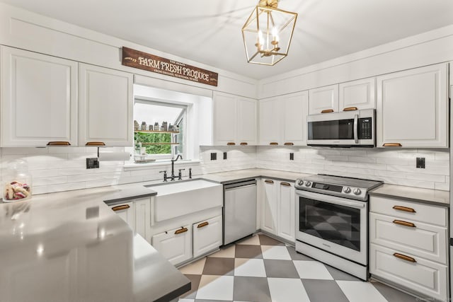 16 Pond Crest Rd, Danbury, CT 06811 - kitchen with appliances with stainless steel finishes, light floors, white cabinetry, a chandelier, and decorative backsplash